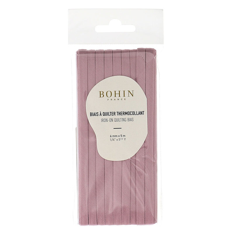 Light mauve bias tape in packaging labeled Bohin iron on quilting bias, isolated on a white background.
