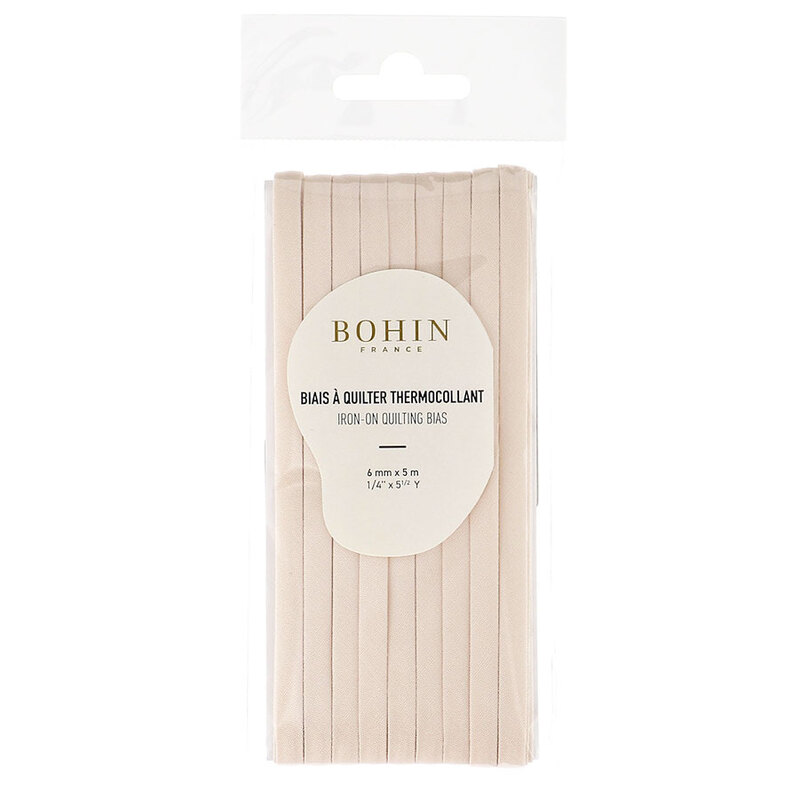Salmon pink bias tape in packaging labeled Bohin iron on quilting bias, isolated on a white background.