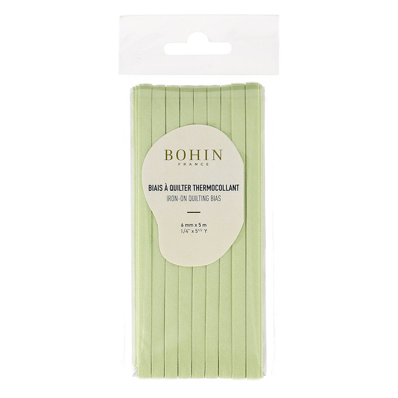 almond green bias tape in packaging labeled Bohin iron on quilting bias, isolated on a white background.