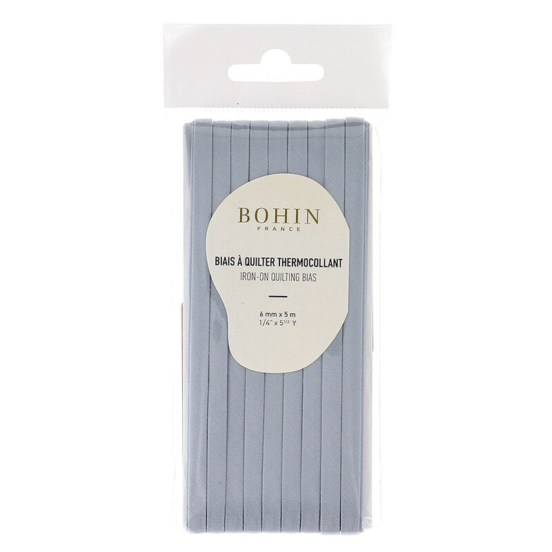 almond green bias tape in packaging labeled Bohin iron on quilting bias, isolated on a white background.