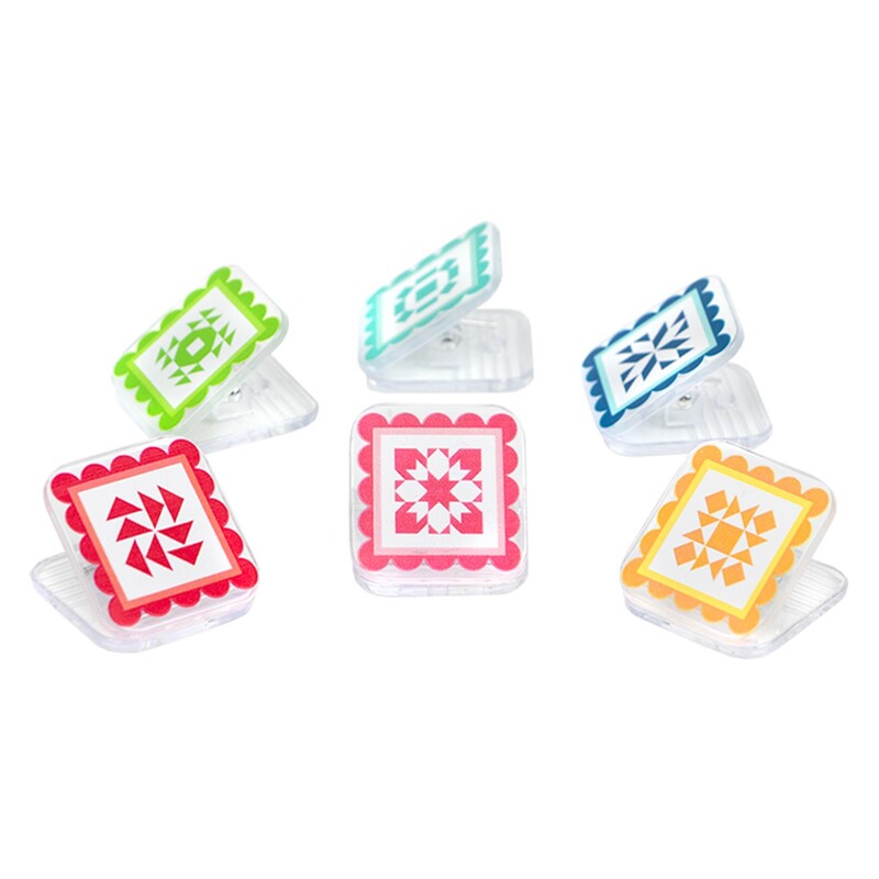 The quilty clippies fabric clips by Its Sew Emma featuring all 6 colors and patterns, isolated on a white background. 