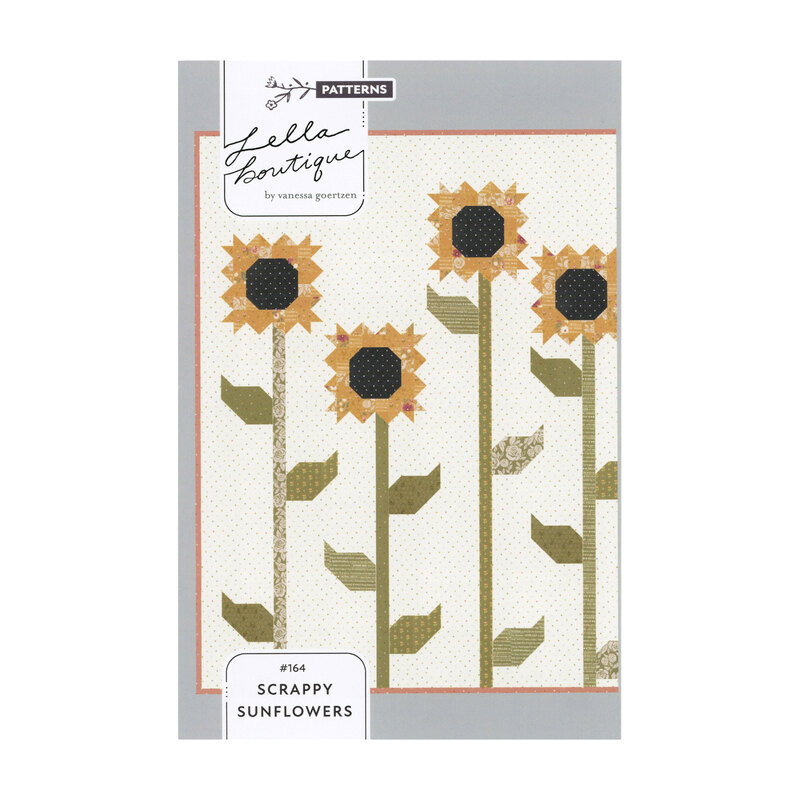 Pattern book of large yellow sunflowers with sawtooth blooms against a cream dotted background from the Scrappy Sunflowers pattern by Lella Boutique.