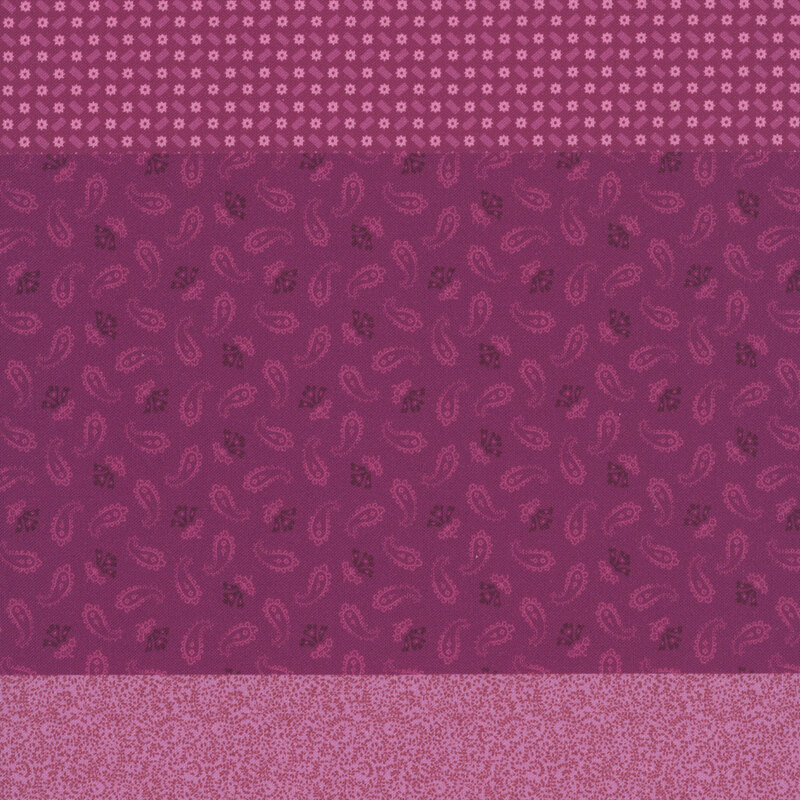 Magenta fabric with a distinctive striped design with 8 unique coordinating patterns, including florals, paisley, dots, and other classic motifs.
