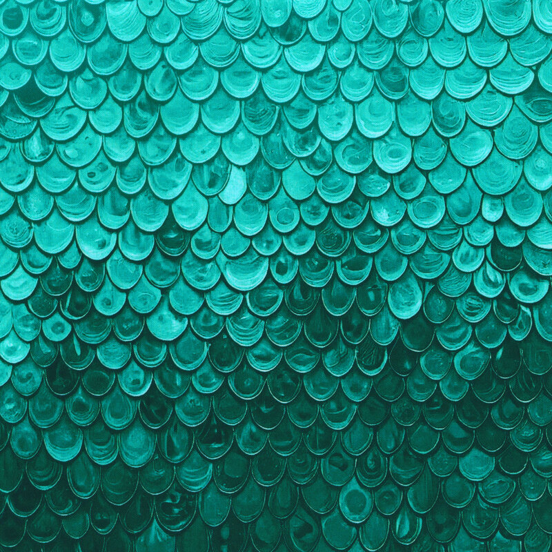 An aqua fabric featuring layered scallops.