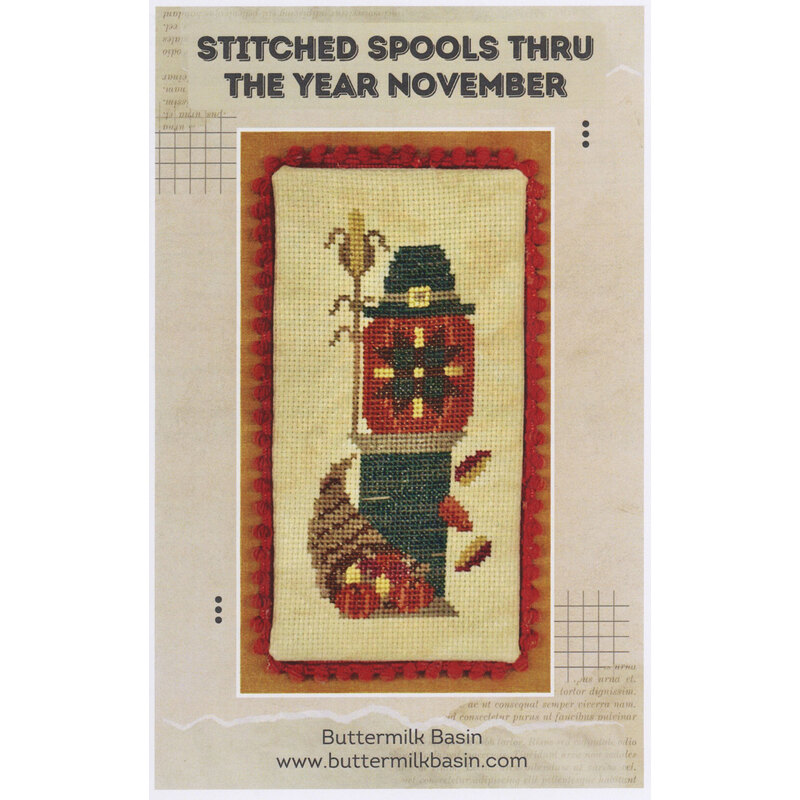 Cross-stitch pattern cover with a fall-themed stitched spool design and acorns.