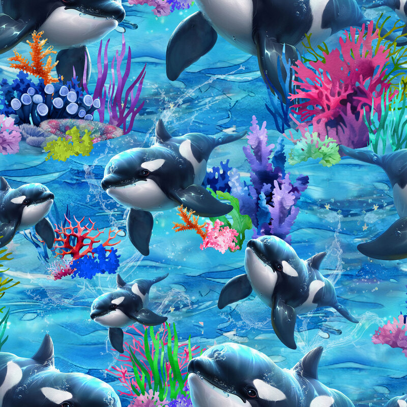 An ocean blue and azure water fabric featuring colorful coral and swimming orcas.