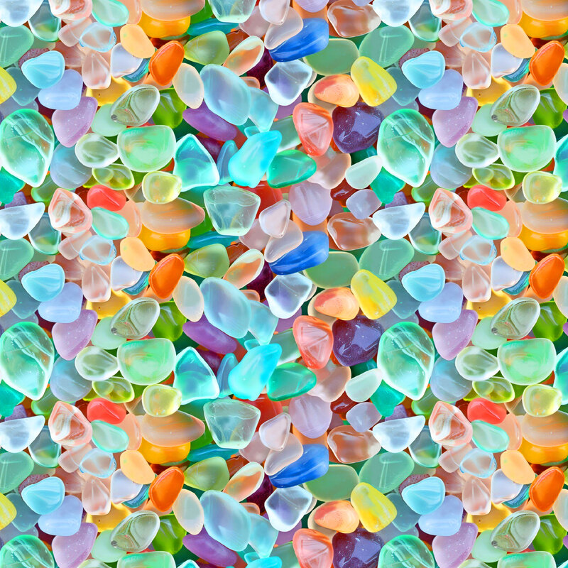 fabric featuring a packed collection of multicolored sea glass.