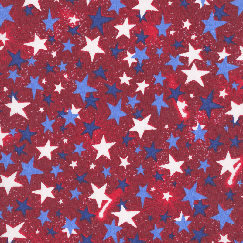 Patriotic deep red fabric with tossed tonal, blue, and white stars.