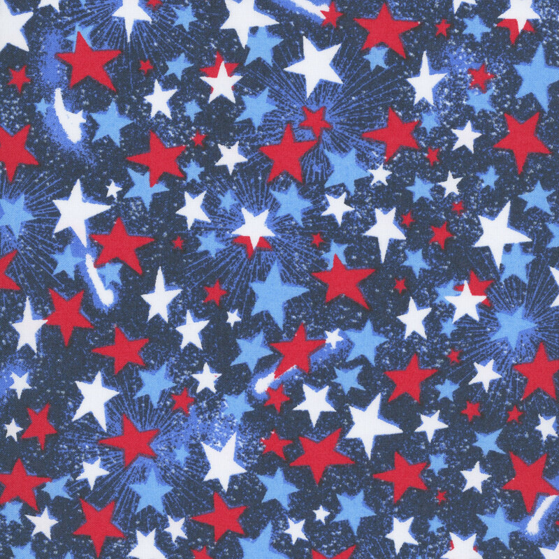 Patriotic dark navy blue fabric with tossed tonal, red, and white stars.
