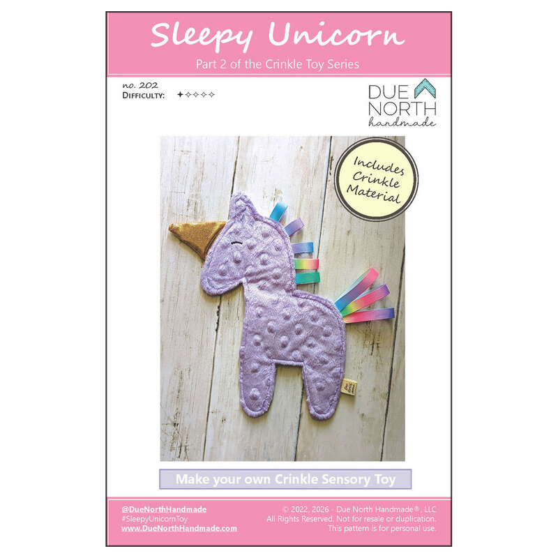 front cover of the Sleepy Unicorn Crinkle Toy pattern featuring a finished purple minky dot unicorn toy with colorful ribbon hair and a golden horn.