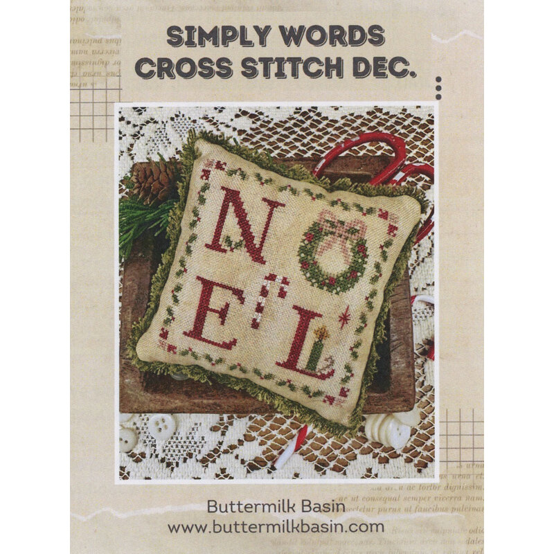 Book cover for “Simply Words Cross Stitch Dec.” showing a stitched monogram pillow with letters N, O, E, and L.