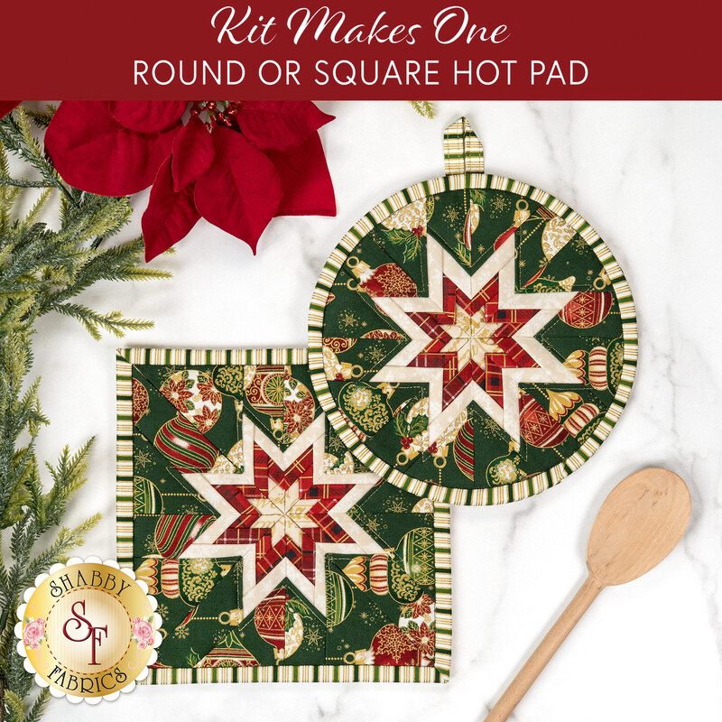 The two completed Folded Star Hot Pads colored in red, green, and white fabrics from the Poinsettias at Christmas collection by Jennifer Bosworth for Riley Blake Designs, one round and one square, slightly overlapping each other and staged on a white table with coordinating décor.