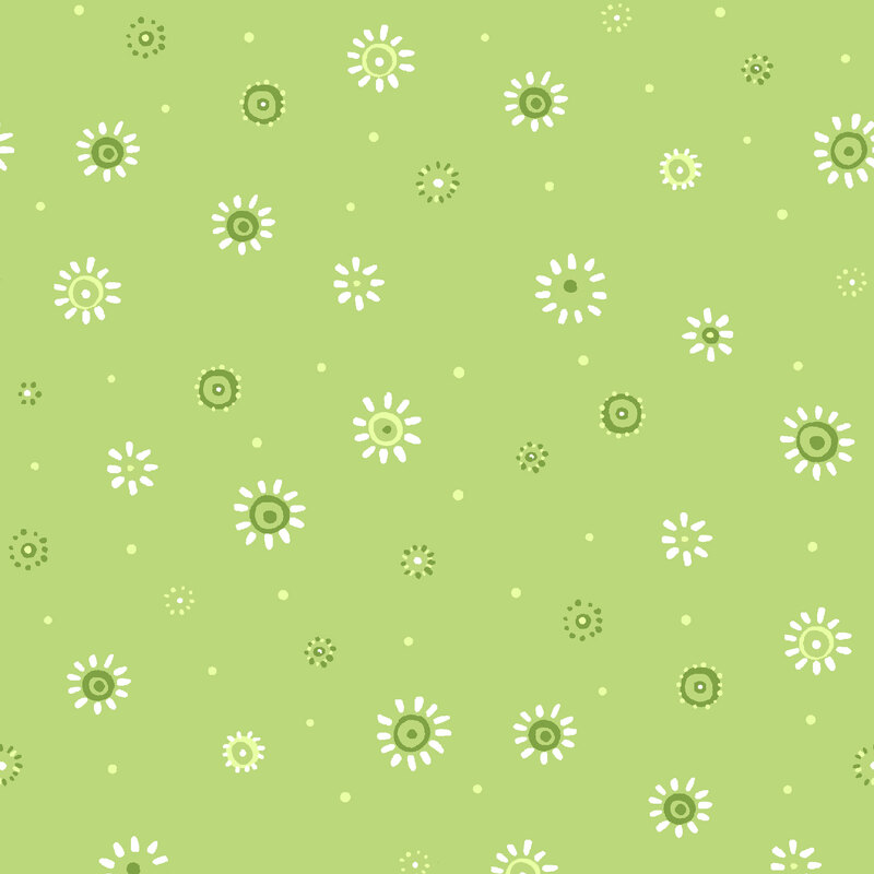Celery green fabric with a pattern of white and green scattered dots and stylized florals.
