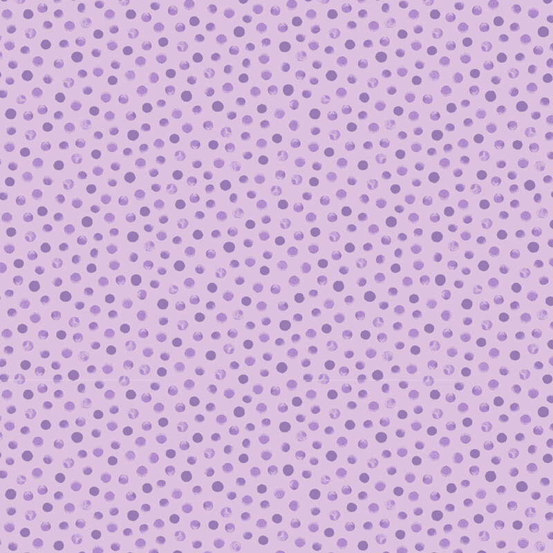 Tonal, lilac colored fabric with a scattered pattern of wisteria purple dots.