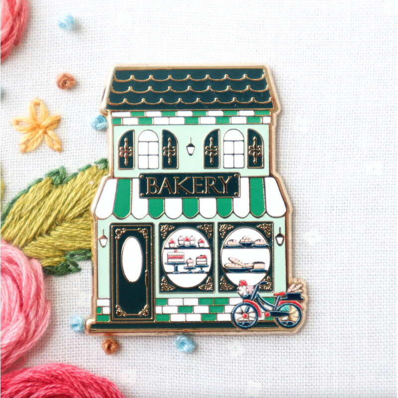 The Bakery needle minder displayed on a hand embroidery project.