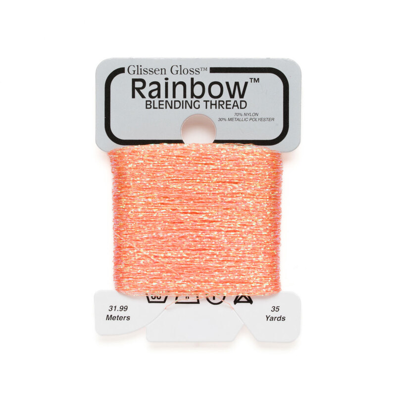 Iridescent bright peach Glissen Gloss Rainbow blending thread spool on white background.