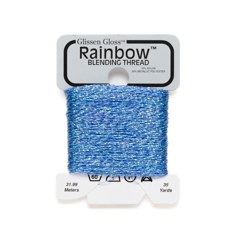 Iridescent cornflower blue Glissen Gloss Rainbow blending thread spool on white background.
