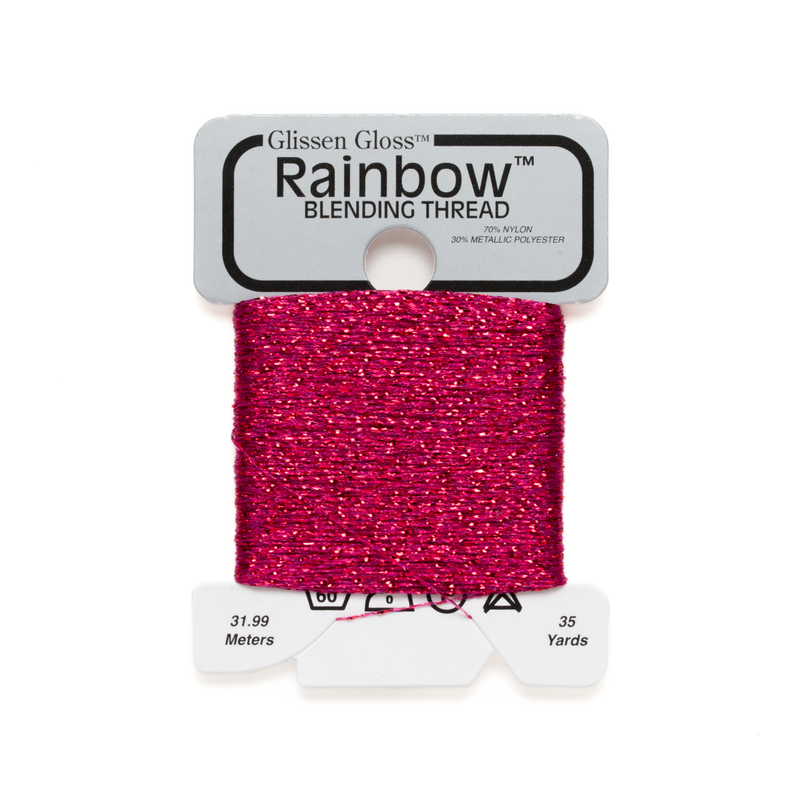 Iridescent hot pink Glissen Gloss Rainbow blending thread spool on white background.