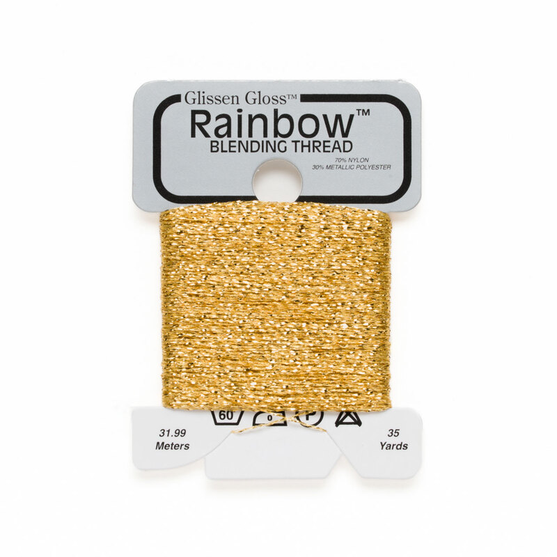Iridescent warm golden yellow Glissen Gloss Rainbow blending thread spool on white background.