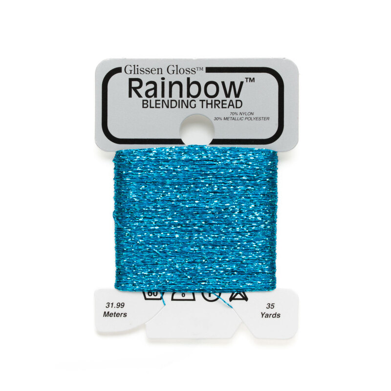Iridescent teal blue Glissen Gloss Rainbow blending thread spool on white background.