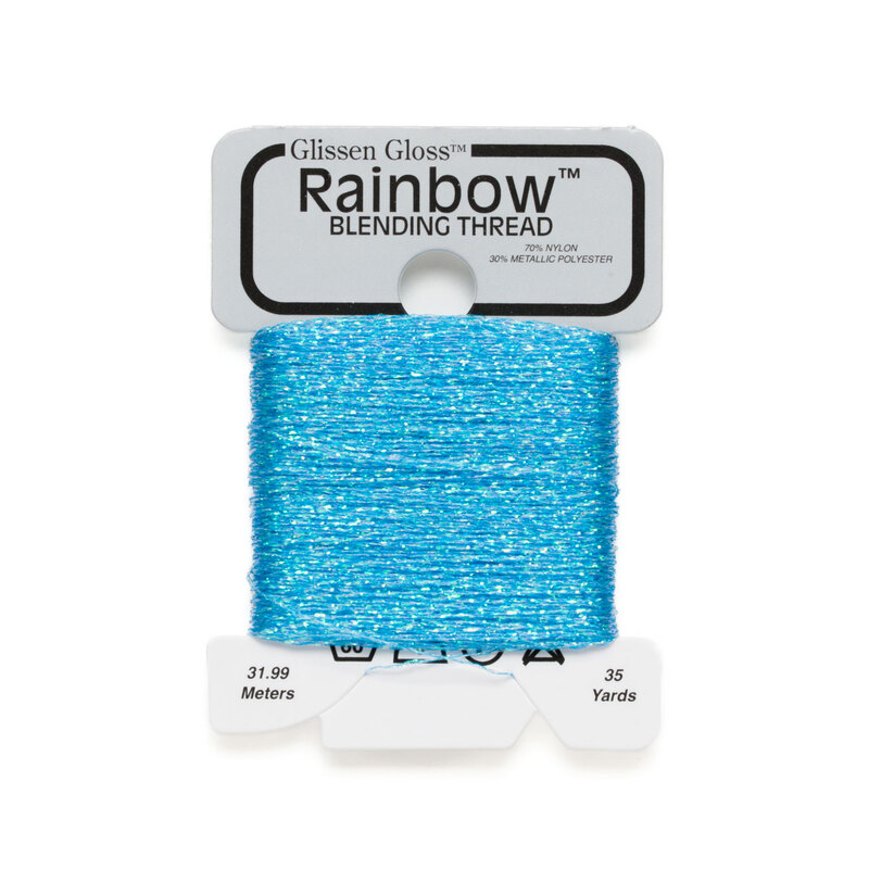 Iridescent blue Glissen Gloss Rainbow blending thread spool on white background.