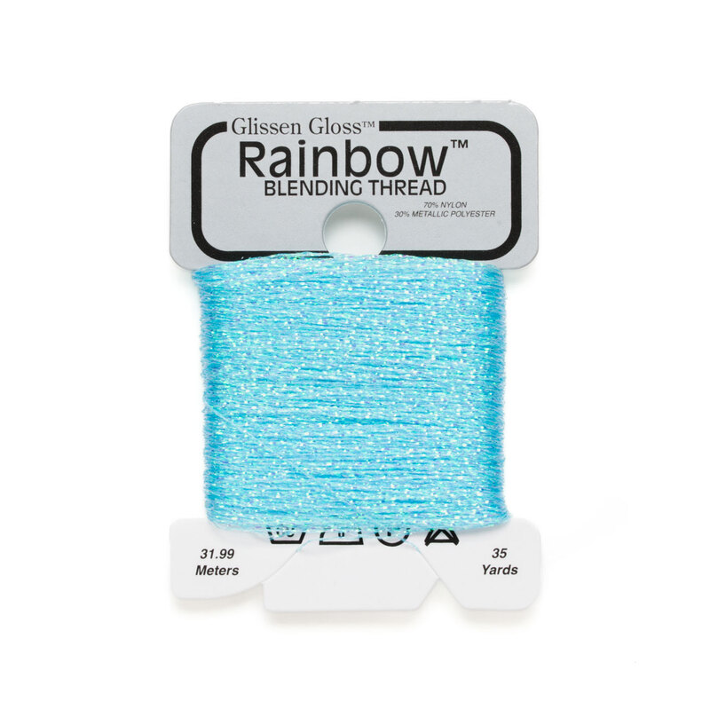 Iridescent bright blue Glissen Gloss Rainbow blending thread spool on white background.
