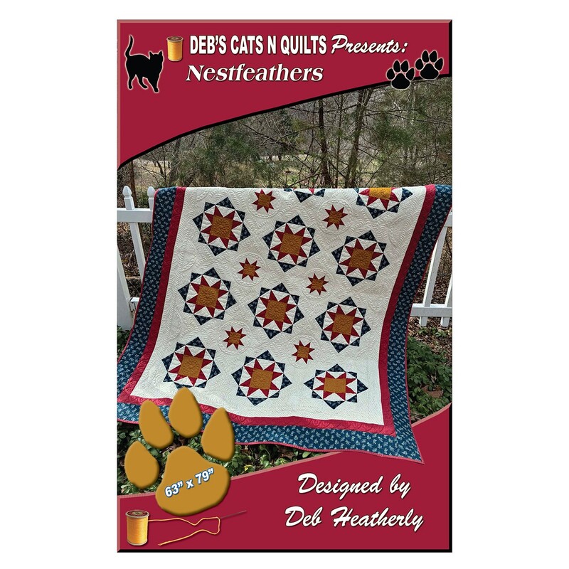 The front of the Nestfeathers pattern with the completed quilt displayed over a white picket fence.
