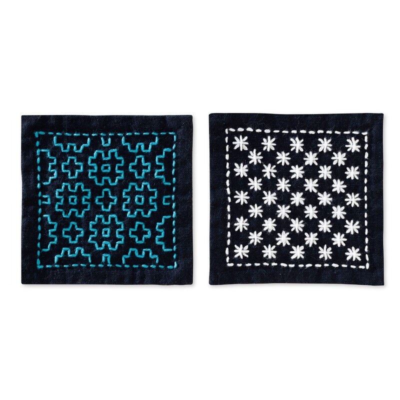 The two complete coasters with sashiko stitching, isolated on a white background.