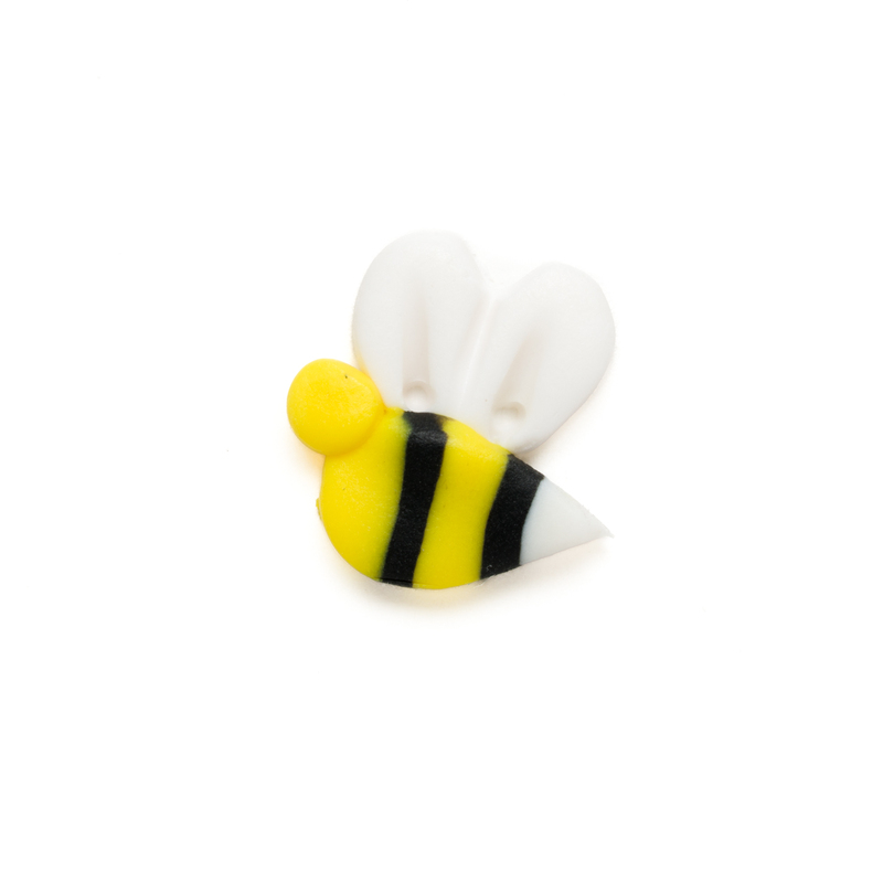 Medium yellow and black bee clay button isolated on a white background.