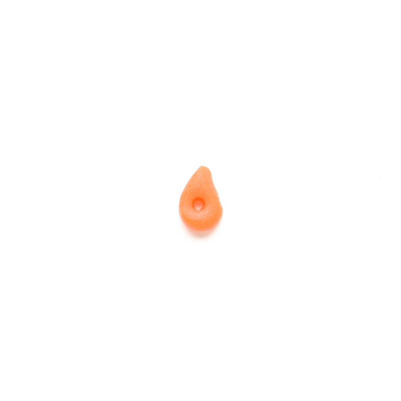 Orange carrot-shaped clay button on a white background.