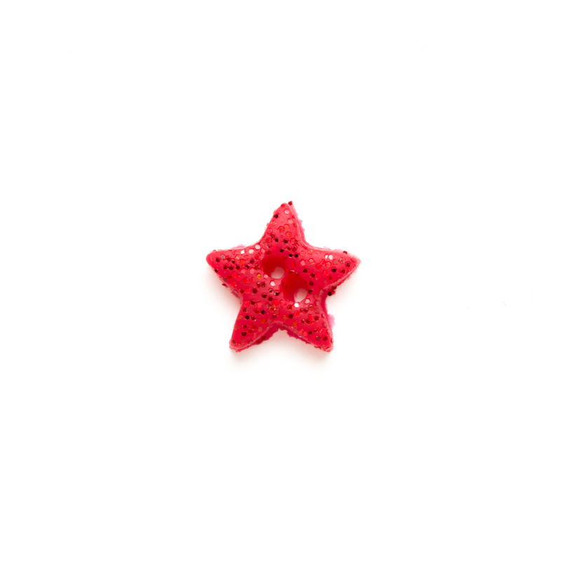 Red glittery star ribbon button, isolated on a white background. 