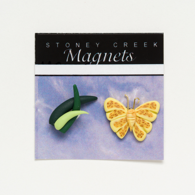 Package of Stoney Creek magnets with a green leaf and yellow butterfly design.