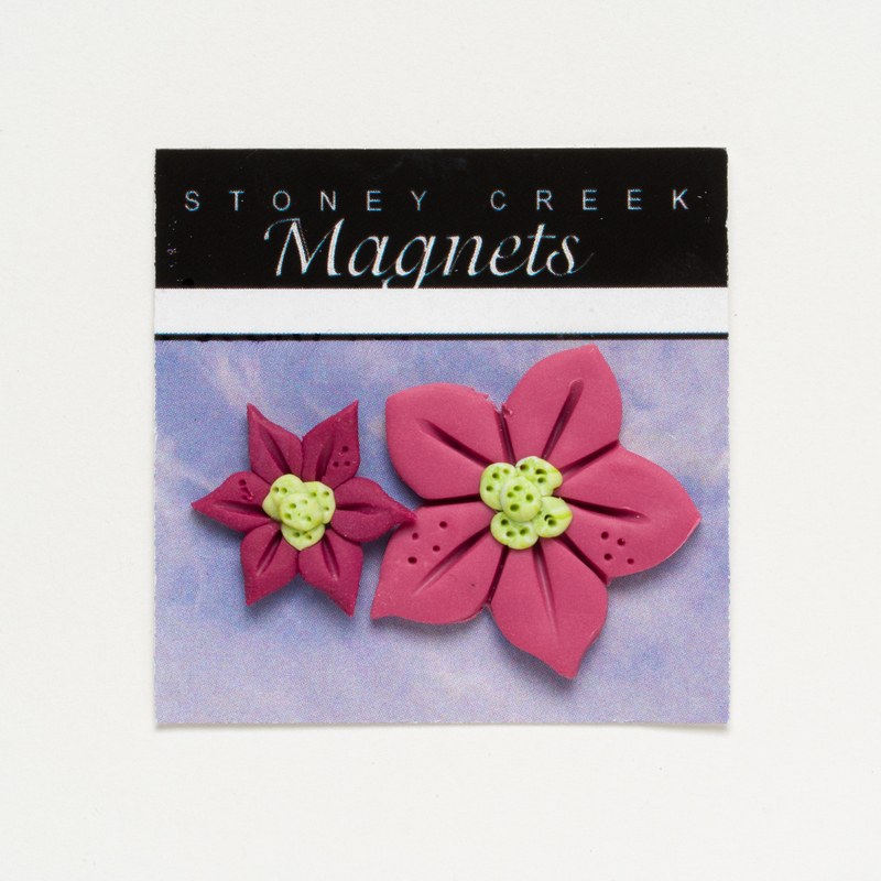 Stoney Creek magnets package with two pink flower magnets on a lavender background.