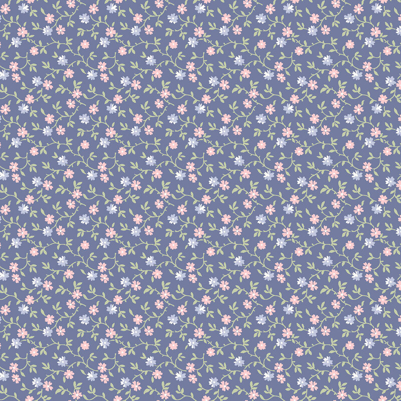 dark periwinkle fabric with a pattern of leafy green vines accented with pink and blue blossoms 