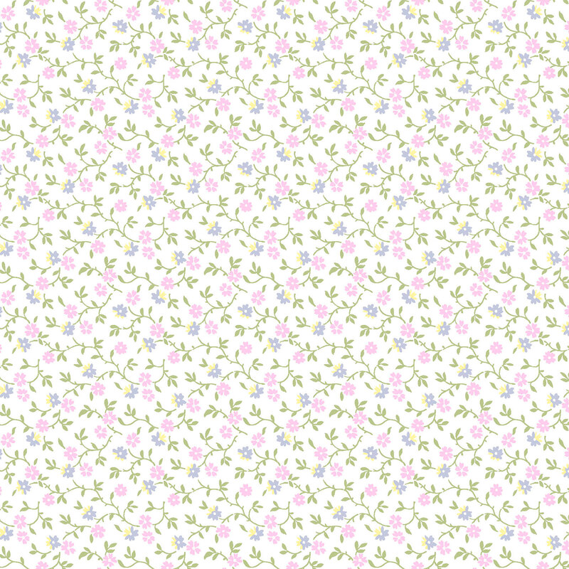 White fabric with a pattern of leafy green vines accented with pink, blue, and yellow blossoms 