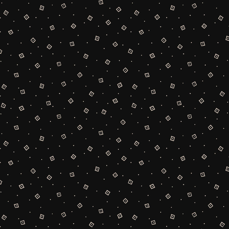 A black fabric scattered with squares and dots. 