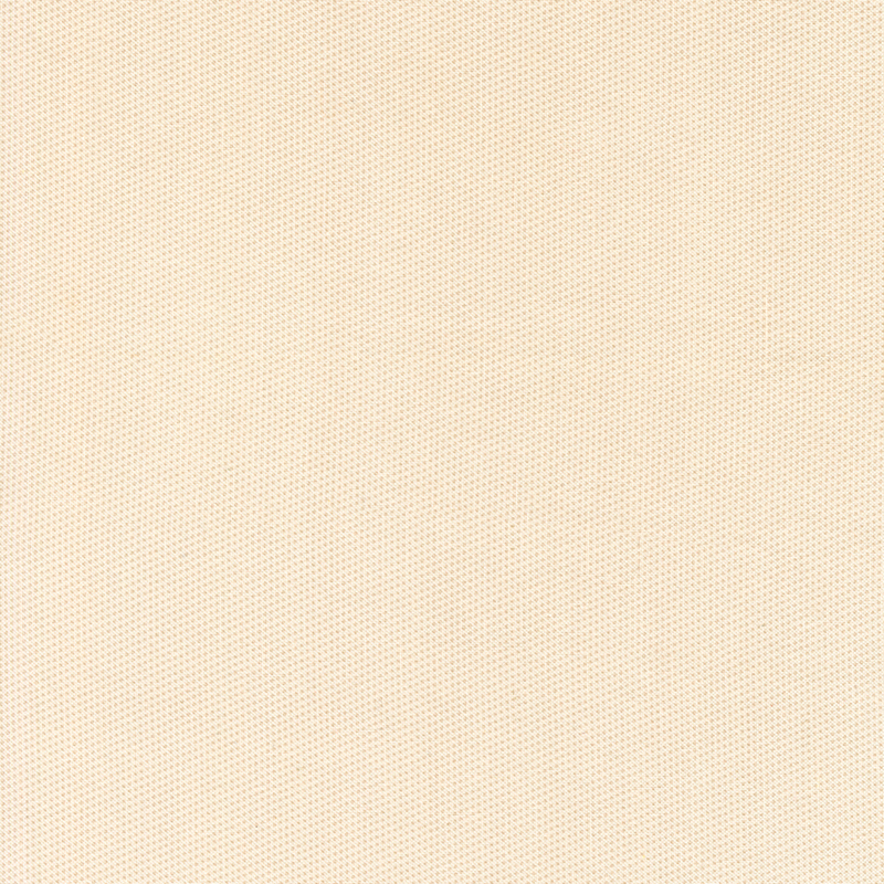 Basic cream fabric with a packed pattern of small tan dots.
