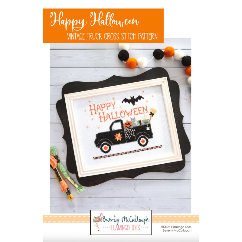 Front cover of the Happy Halloween cross stitch pattern of the finished product in frame and surrounded by coordinating décor.