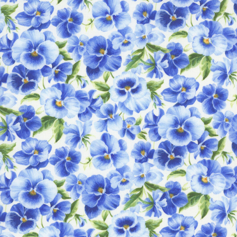 Ivory fabric packed with light and dark blue pansies.