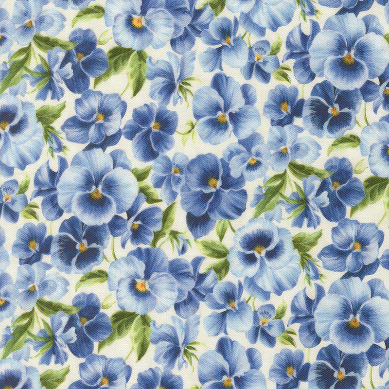 Ivory fabric packed with light and dark blue pansies.