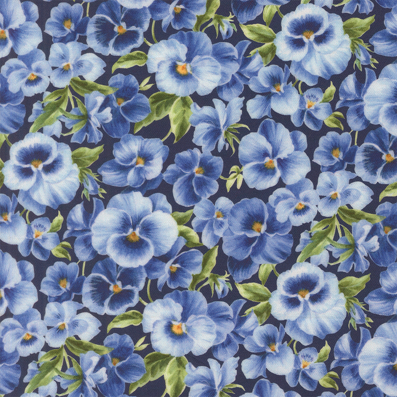 Lagoon blue fabric packed with light and dark blue pansies.
