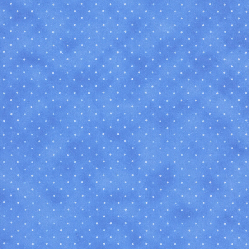 Cornflower blue fabric with a multicolored staggered grid of small dots on a mottled background.