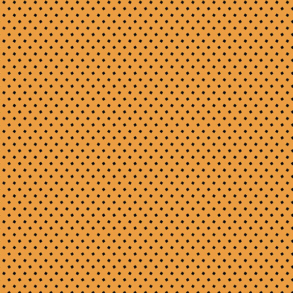 This pumpkin orange fabric features tiny black squares. 