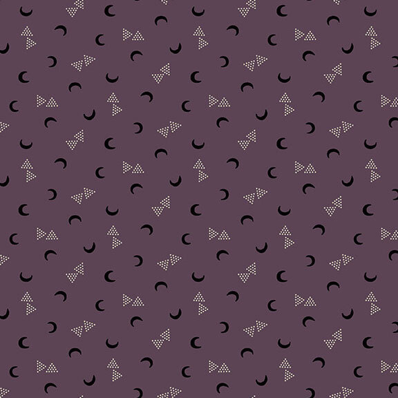This muted purple fabric features black crescent moons and clusters of dotted triangles. 