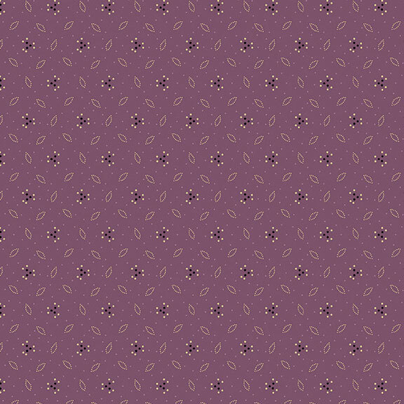 This muted purple fabric features a design of dotted leaves and flowers. 