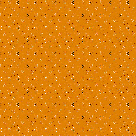 This mandarin orange fabric features a design of dotted leaves and flowers. 