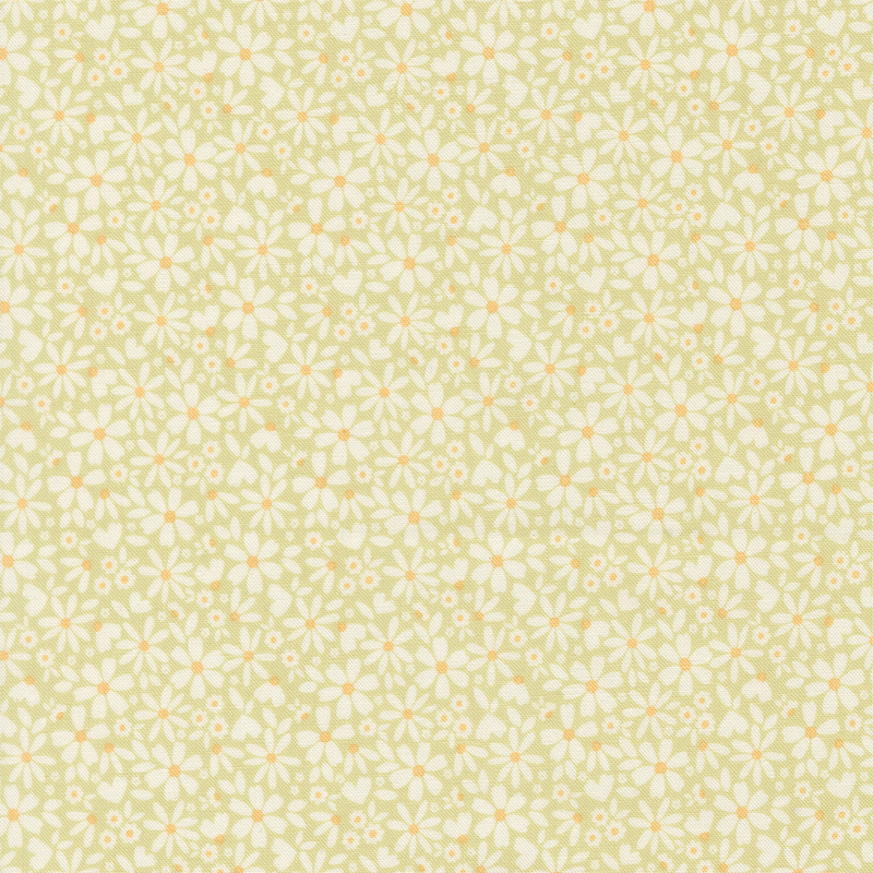 This spring green fabric features packed white daisies. 