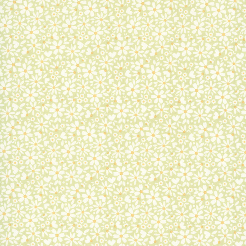 This spring green fabric features packed white daisies. 