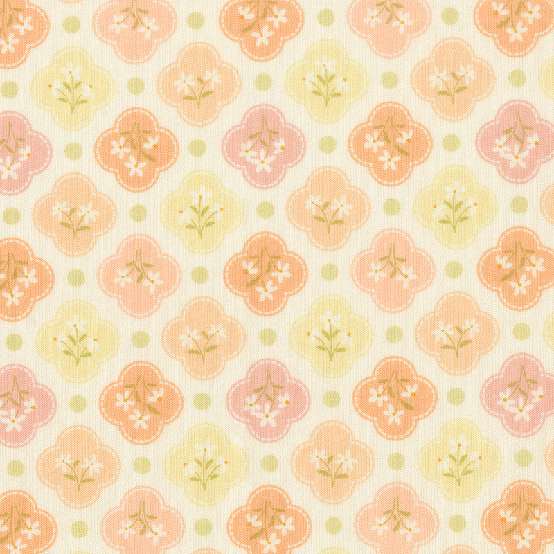 This white fabric features pastel yellow, peach, and pink quatrefoils amongst spring green dots. 