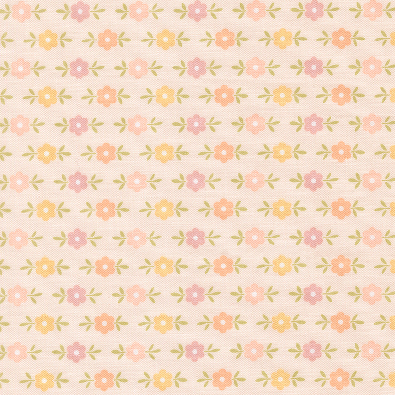 This blush pink fabric features pastel pink, golden yellow, and light coral floral motifs. 